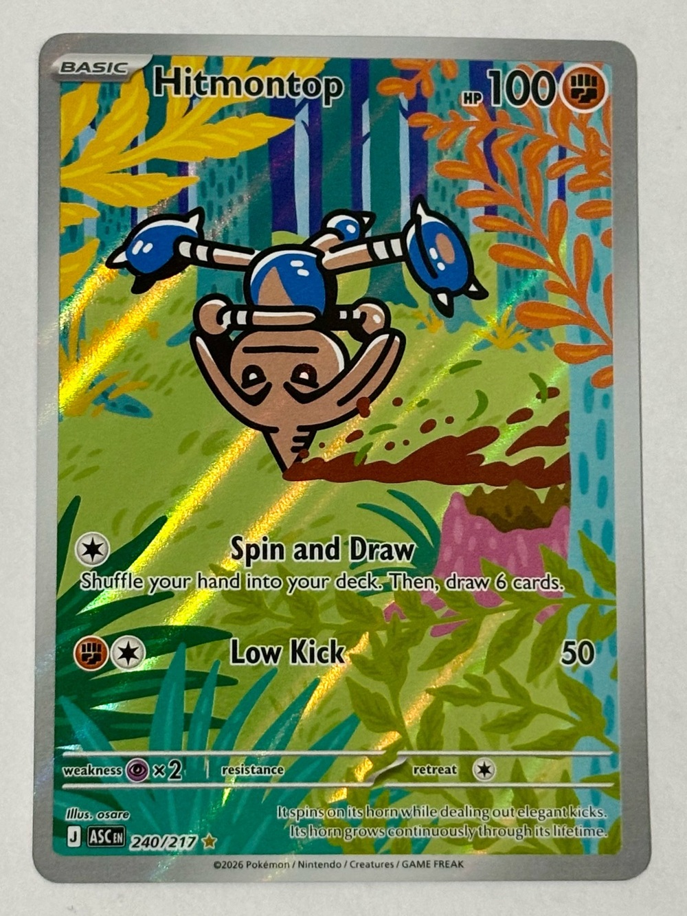Mint Pokemon TCG Hitmontop Holographic Card - Blue, Yellow, Green